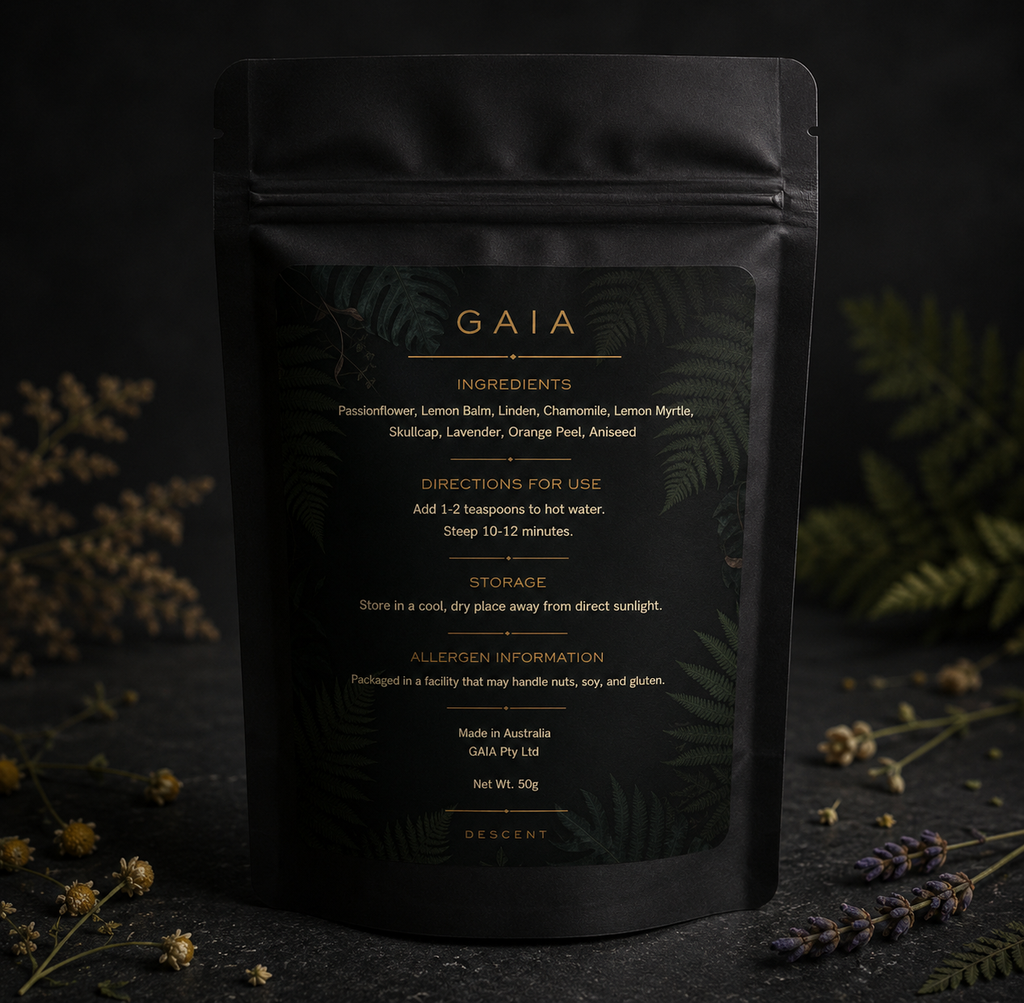 Black tea package with 'Gaia' branding on a dark background with herbs and flowers.