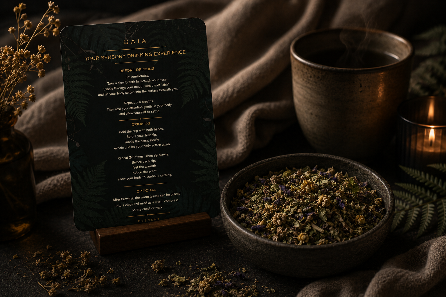 Tea-making setup with a sign, cup, and bowl of tea leaves on a dark background.
